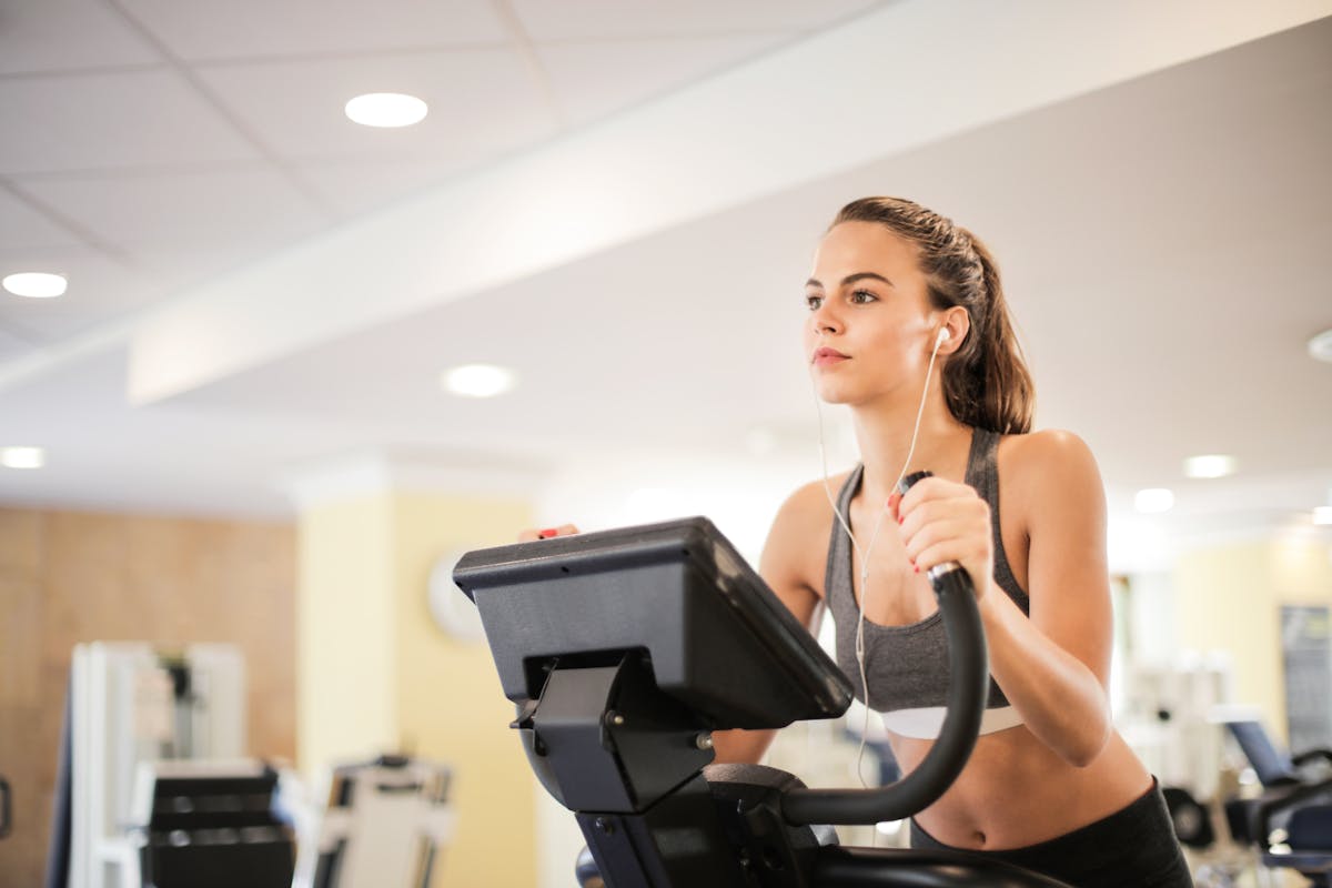 Active woman working out at gym representing IV therapy target demographic