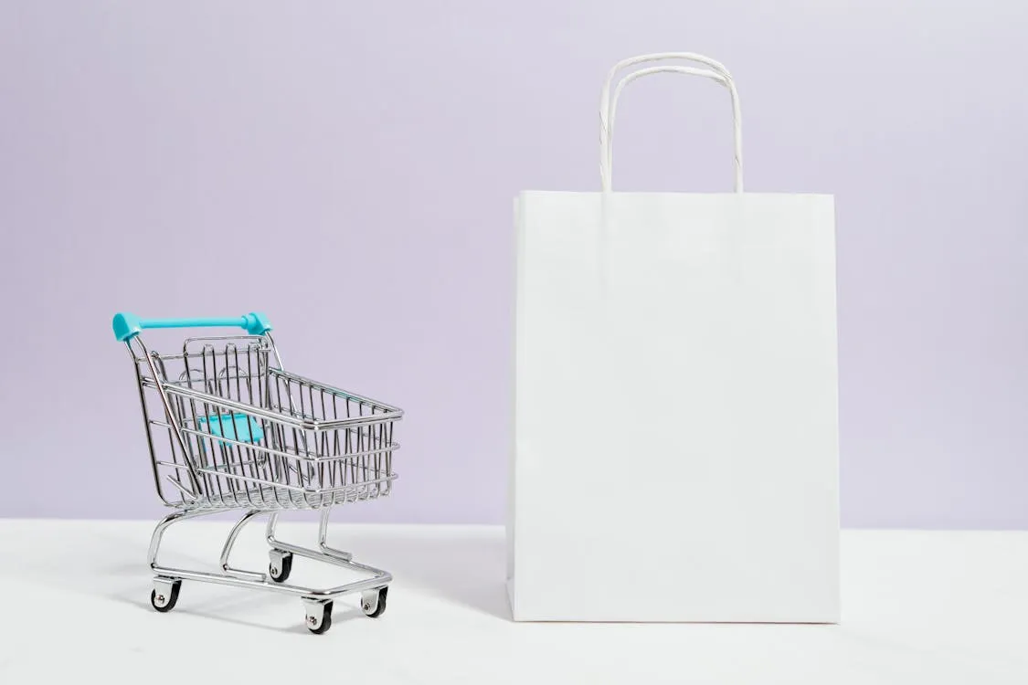 Professional product photography setup for e-commerce store with branded packaging and marketing materials