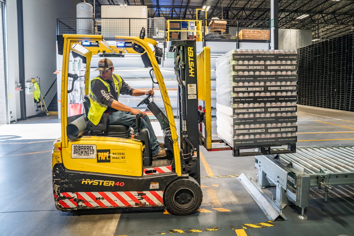 Industrial warehouse interior with modern manufacturing equipment and logistics operations