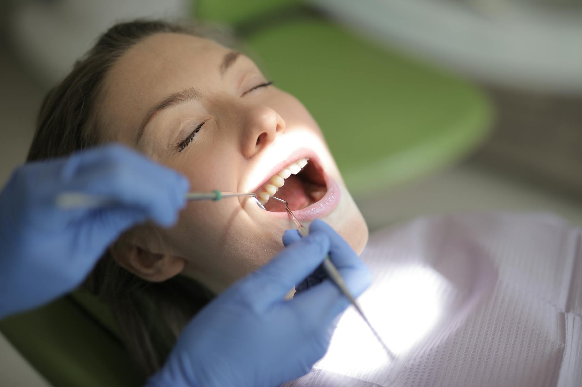Patient receiving dental exam in a modern practice