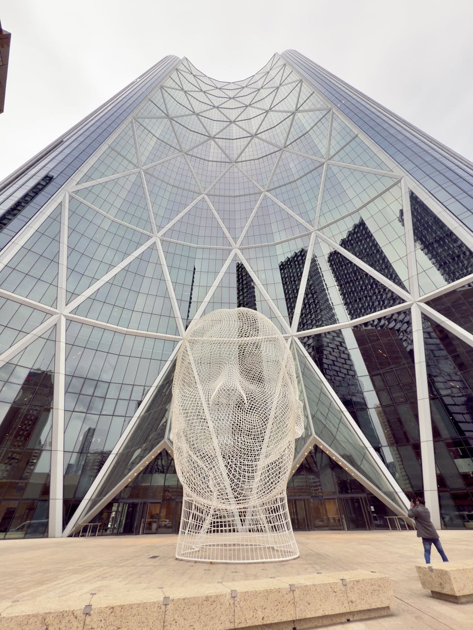 Architectural sculpture with modern glass building